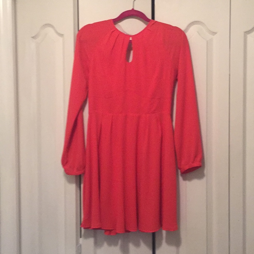 Beautiful long sleeve above the knee dress.